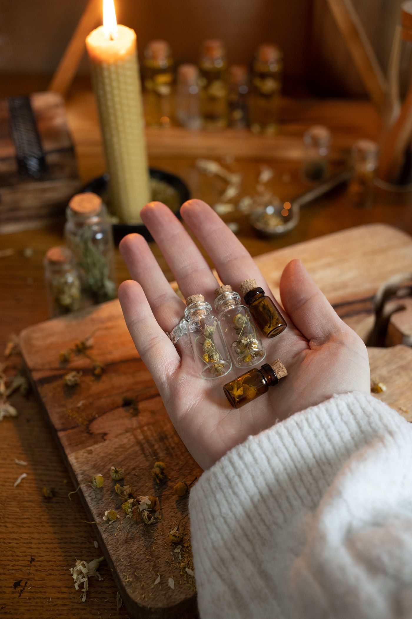 Hands reviewing supplement samples and notes at a workspace